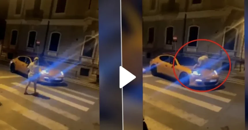 O femeie a traversat peste capota unui Porsche oprit pe trecere.